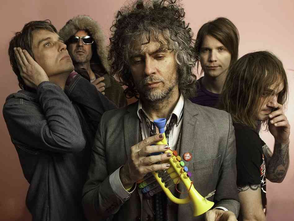 Wayne Coyne (center) with the rest of The Flaming Lips. Wayne Coyne (center) with the rest of The Flaming Lips.